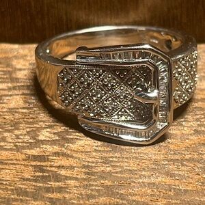 This handsome vintage sterling silver and rhinestone buckle style ring